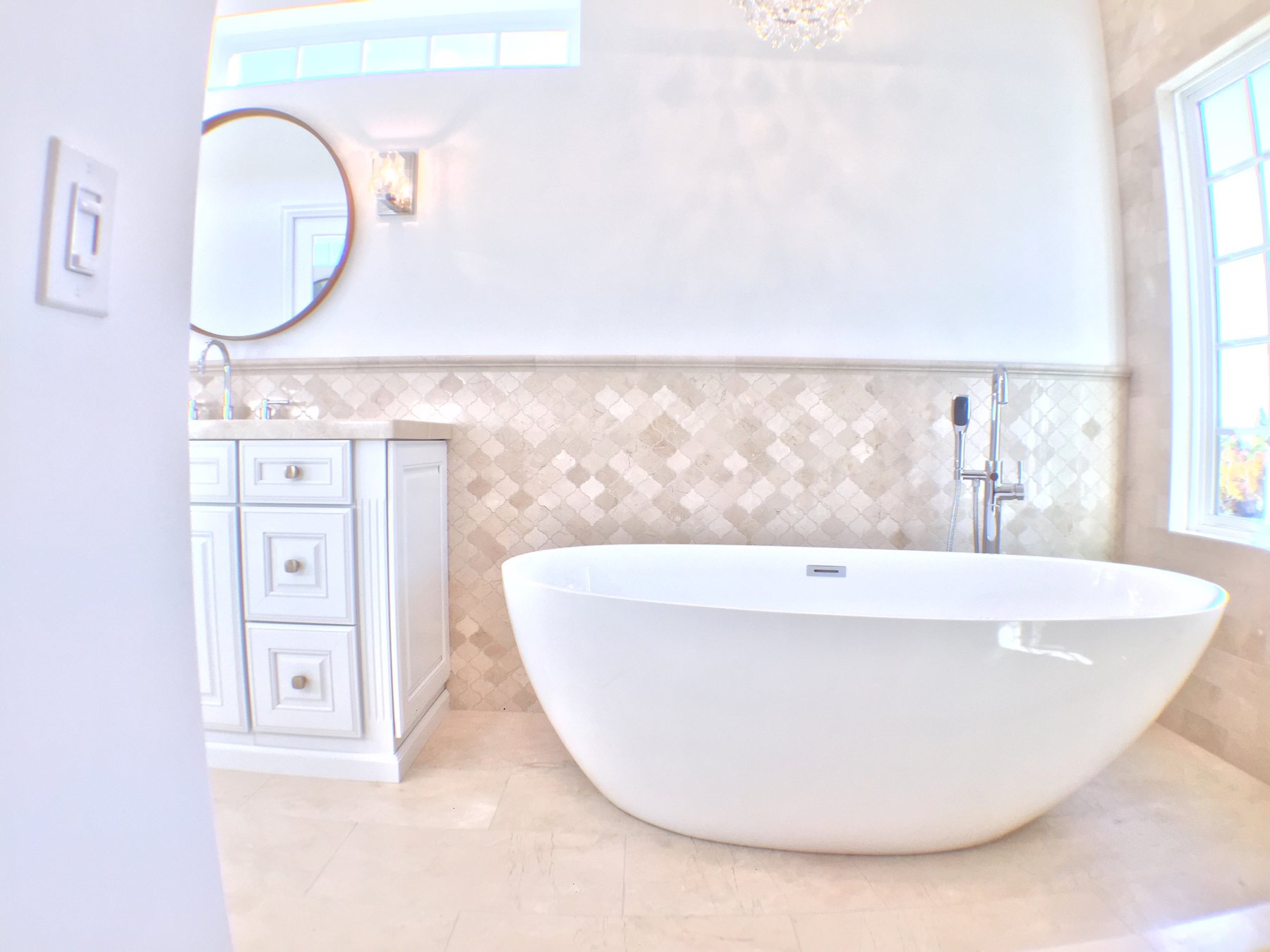 Custom bathroom cabinetry and finishes by Blackbird Construction